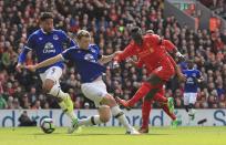 <p>Liverpool’s Sadio Mane, right, scores his side’s first goal, during the English Premier League soccer match between Liverpool and Everton, at Anfield, in Liverpool </p>