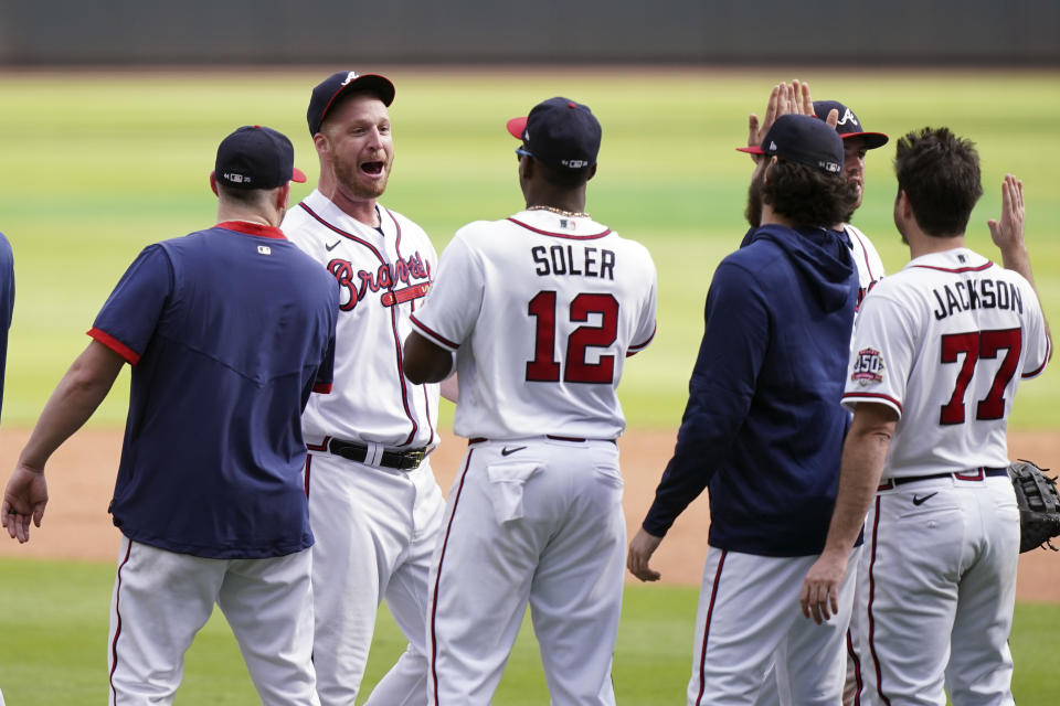 Atlanta Braves closer Will Smith (51) celebrates after the ninth inning of Game 3 of a baseball National League Division Series against the Milwaukee Brewers, Monday, Oct. 11, 2021, in Atlanta. The Atlanta Braves won 3-0. (AP Photo/Brynn Anderson)