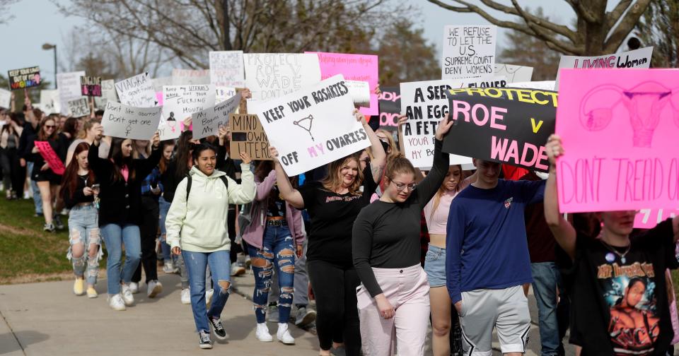 Participants rally in support of Roe v. Wade during an event at UW-Green Bay on May 5, 2022, in Green Bay, Wis.