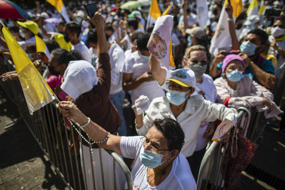 A faithful, holding a Vatican flag, takes part in a procession in Managua, Nicaragua, Saturday, Aug. 13, 2022. The Catholic Church has called on the faithful to peacefully arrive at the Cathedral in Managua Saturday after National Police denied permission for a planned religious procession on “internal security” grounds. (AP Photo)