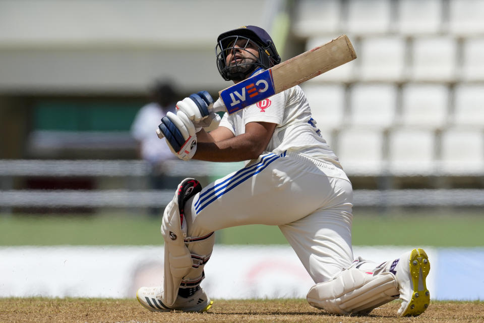 India's captain Rohit Sharma plays a shot against West Indies on day two of their first cricket Test match at Windsor Park in Roseau, Dominica, Thursday, July 13, 2023. (AP Photo/Ricardo Mazalan)