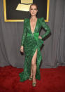 <p>Queen Celine walked the red carpet in a plunging, beaded Kelly Green gown accentuated with a matching bow. </p>