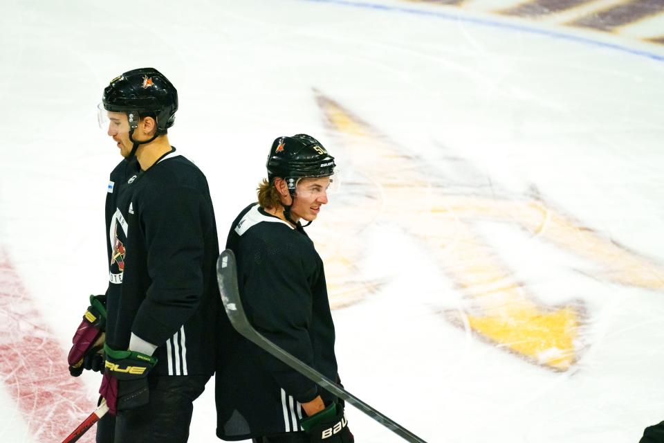 Josh Brown (3), and Troy Stecher (51) practice with the Coyotes at Mullett Arena in ASU's Tempe campus on Oct. 27, 2022.