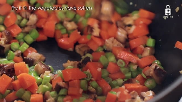 Frying vegetables in wok