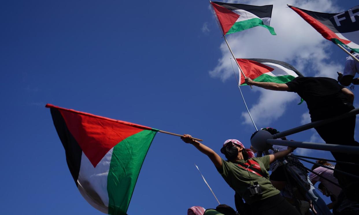 <span>People participate in a protest calling for a ceasefire in Gaza on the opening day of the Democratic national convention in Chicago, Illinois, on 19 August.</span><span>Photograph: Will Oliver/EPA</span>