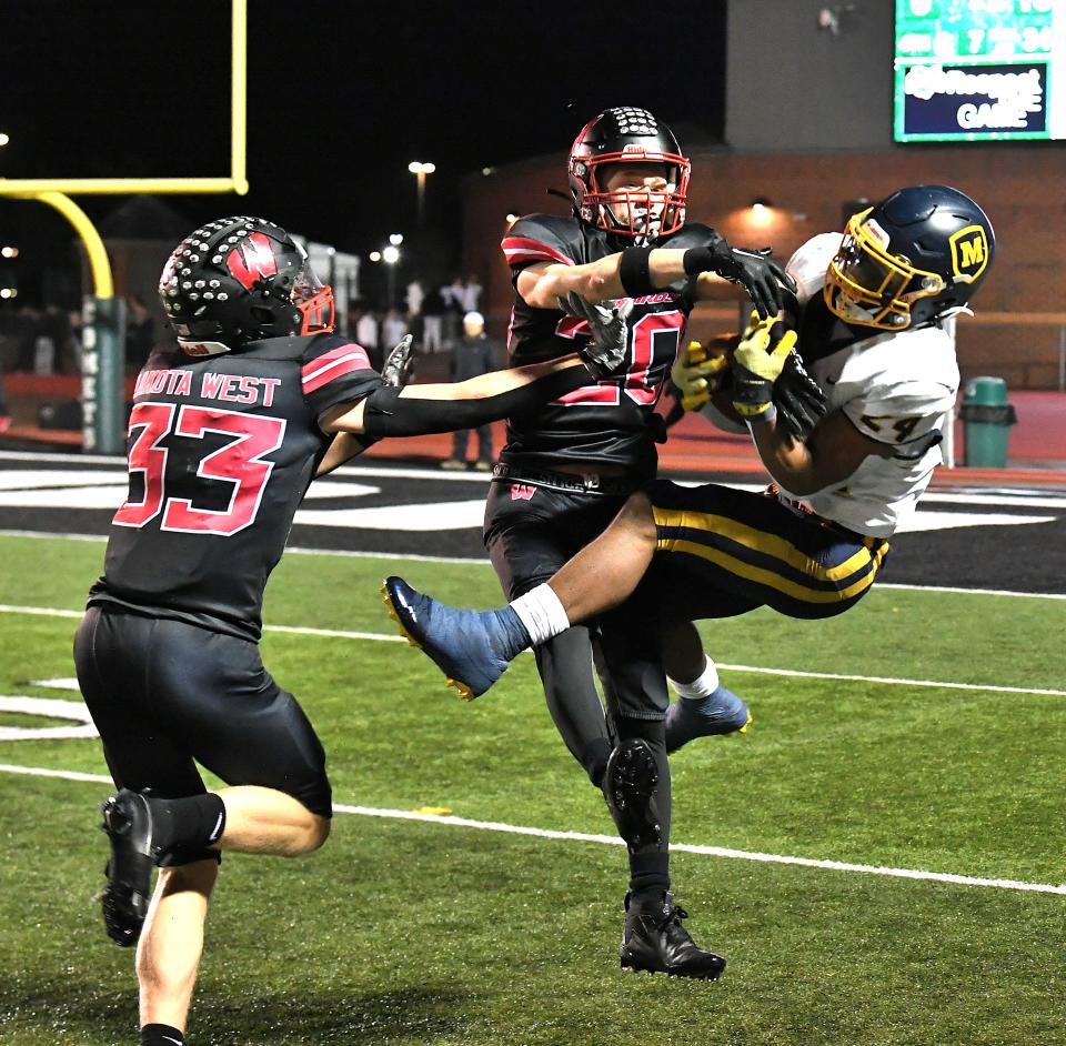 Grant Beerman (33) and Cam Thomas are both expected to play Power Four college football after their high school careers.