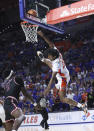 Florida guard Tyree Appleby (22) is fouled by Troy guard Desmond Williams (11) during the second half of an NCAA college basketball game Sunday, Nov. 28, 2021, in Gainesville, Fla. Williams was called for a flagrant foul and Appleby was called for a technical after the play. (AP Photo/Matt Stamey)