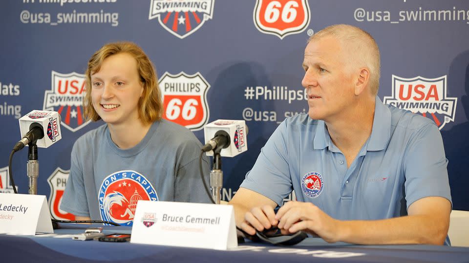 Katie Ledecky and Bruce Gemmell speak during the 2014 Phillips 66 USA National Championships on August 5, 2014 in Irvine, California. - Joe Scarnici/Getty Images