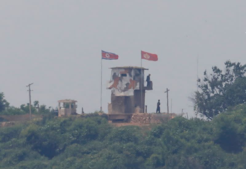 North Korean soldiers are seen at their guard post inside North Korean territory, in this picture taken from Paju, South Korea, near the demilitarized zone (DMZ) separating the two Koreas