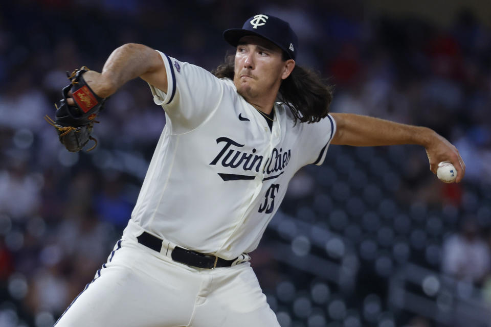 Minnesota Twins relief pitcher Kody Funderburk makes his MLB debut and throws to the Cleveland Guardians in the fifth inning of a baseball game Monday, Aug. 28, 2023, in Minneapolis. (AP Photo/Bruce Kluckhohn)