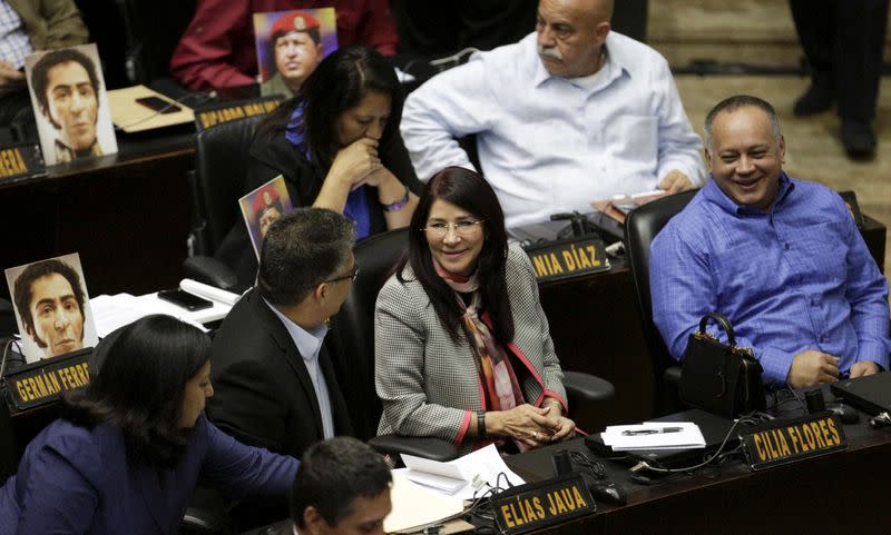 FILE PHOTO: Cilia Flores, deputy of Venezuela's United Socialist Party (PSUV) and wife of Venezuela's President Nicolas Maduro, and her fellow deputy Diosdado Cabello (R) attend a session of the National Assembly in Caracas