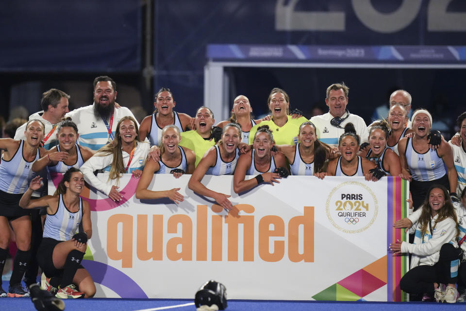 Team Argentina poses for a group photo after winning the women's field hockey gold medal match against the United States, at the Pan American Games in Santiago, Chile, Saturday, Nov. 4, 2023. (AP Photo/Dolores Ochoa)