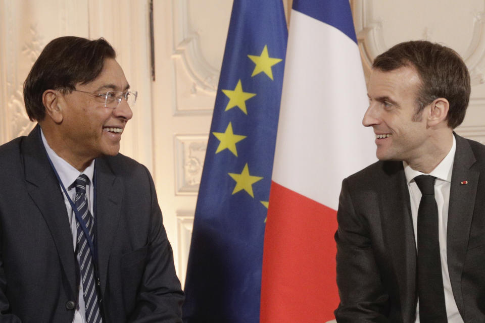 Chairman and CEO of ArcelorMittal Lakshmi Mittal, left, speaks with French President Emmanuel Macron prior to a meeting as part of the second edition of the "Choose France" summit, in Versailles, outside Paris, France , Monday, Jan. 21, 2019. (Geoffroy Van Der Hasselt/Pool Photo via AP)