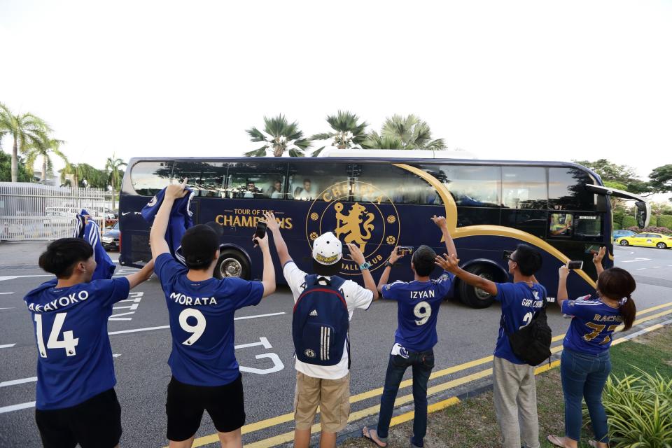 <p>Fans cheer as Chelsea FC team bus departs Jet Quay Private Terminal ahead of the International Champions Cup on July 23, 2017 in Singapore. </p>
