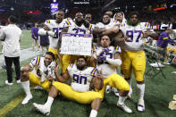 LSU players celebrate after the Southeastern Conference championship NCAA college football game against Georgia, Saturday, Dec. 7, 2019, in Atlanta. LSU won 37-10. (AP Photo/John Bazemore)