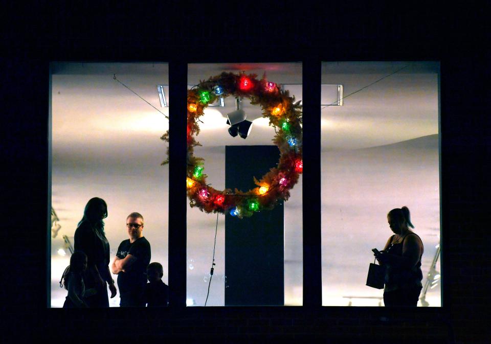 Visitors wander the second floor of the Center for Contemporary Arts on Thursday during ArtWalk.