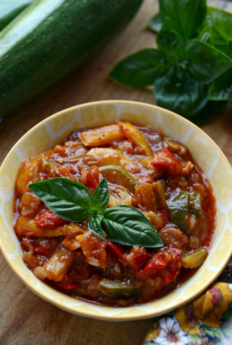 A chunky-looking soup with garnish in a bowl