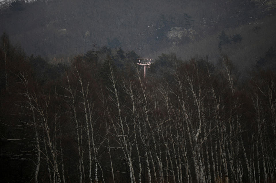 <p>A ski lift tower is seen at the abandoned Alps Ski Resort located near the demilitarized zone separating the two Koreas in Goseong, South Korea, Jan. 17, 2018. (Photo: Kim Hong-Ji/Reuters) </p>