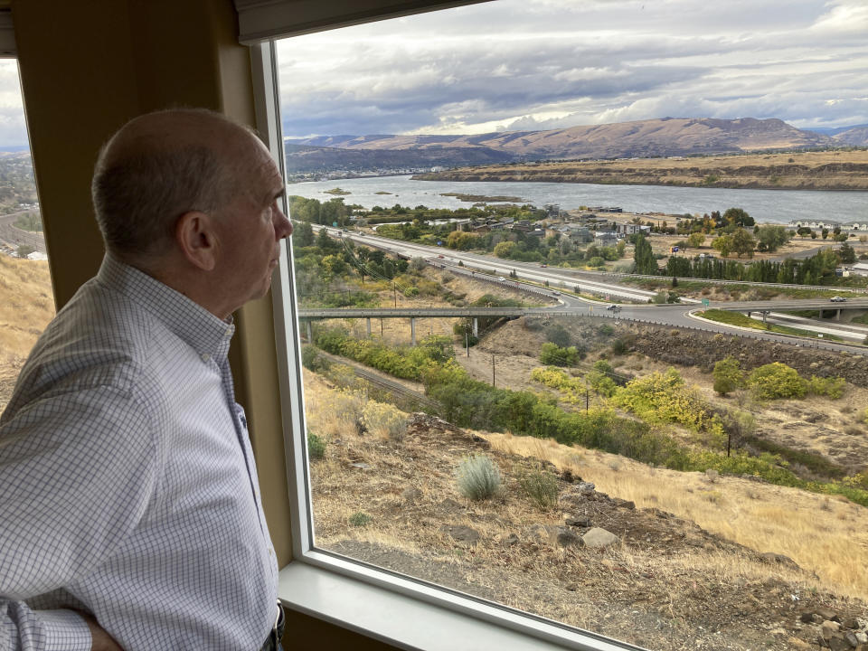 FILE - In this Tuesday, Oct. 5, 2021, photo, The Dalles Mayor Richard Mays looks at the view of his town and the Columbia River from his hilltop home in The Dalles, Ore. Residents of The Dalles should soon know how much of their water Google's data centers there have been using to cool the computers, after a lawsuit seeking to keep the information confidential was dropped. (AP Photo/Andrew Selsky, File)