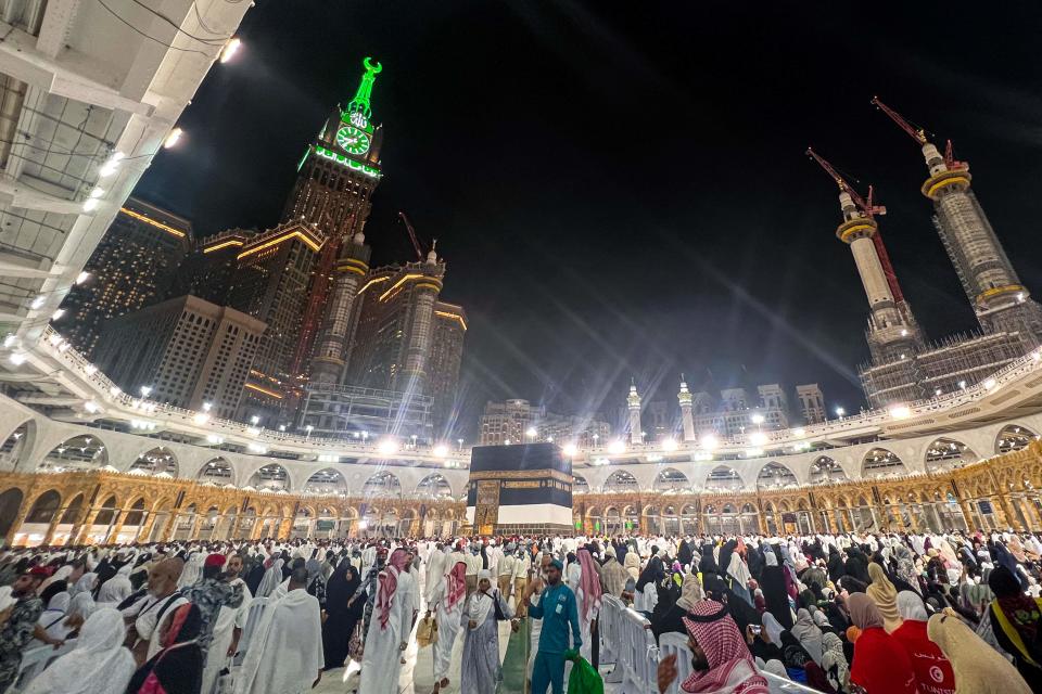 Muslim pilgrims pray around the Kaaba, Islam's holiest shrine, at the Grand Mosque in the holy city of Mecca on June 22, 2023, as they arrive for the annual Hajj pilgrimage.