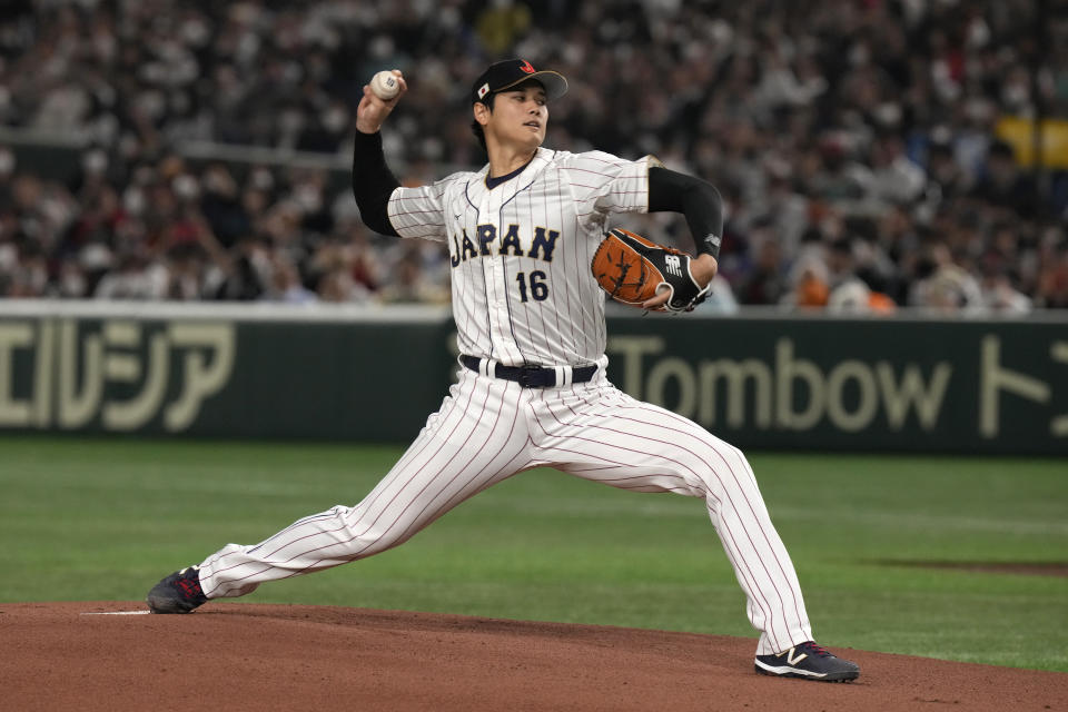 Shohei Ohtani of Japan delivers a pitch against China during the Pool B game at the World Baseball Classic (WBC) in Tokyo, Japan, Thursday, March 9, 2023.(AP Photo/Eugene Hoshiko)