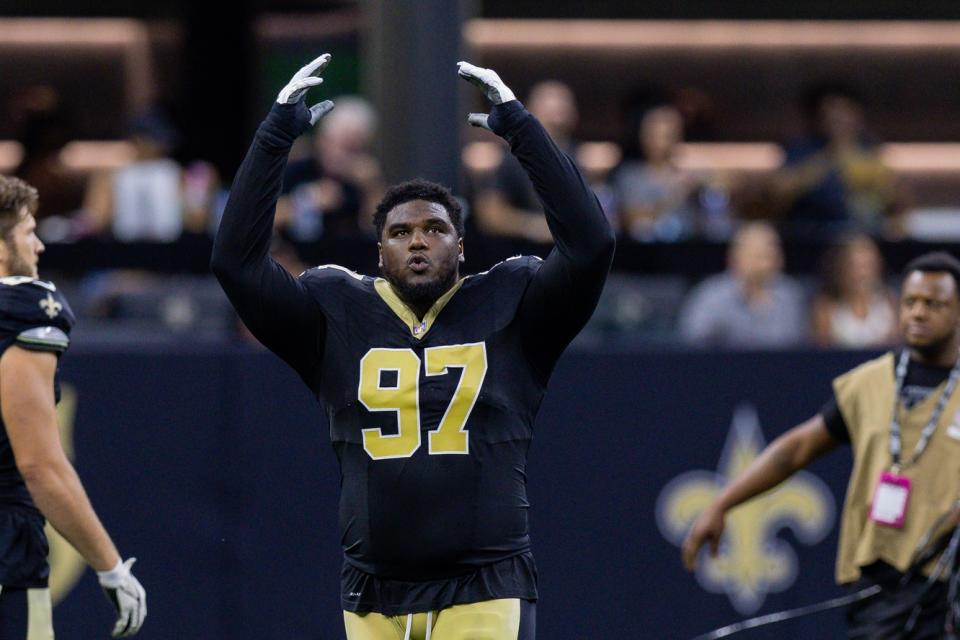 Aug 13, 2023; New Orleans, Louisiana, USA; New Orleans Saints defensive end Malcolm Roach (97) pumps up the fans for the Who Dat chant to start the game against the Kansas City Chiefs at the Caesars Superdome. Mandatory Credit: Stephen Lew-USA TODAY Sports