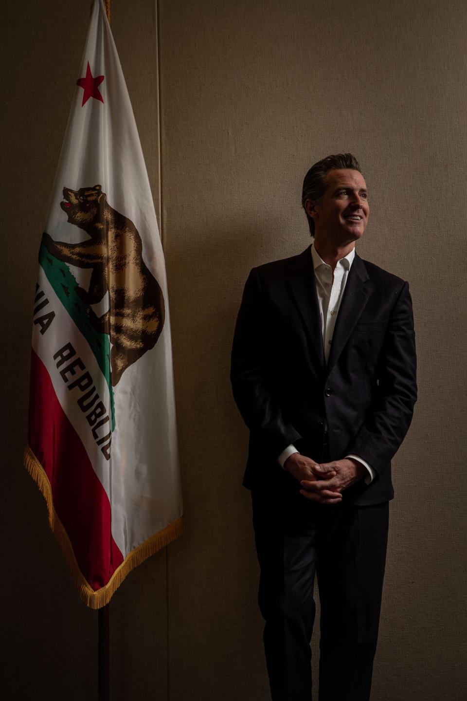 California Gov. Gavin Newsom, pictured here in his office in Sacramento, has been at the helm of state for 11 months. He says he understands critics who say he is trying to tackle too many issues and hasn't gotten enough done to date. But he counters that as governor he is obliged to listen to the issues of all constituents, and vows that change on key issues will come during the rest of his first four-year term.