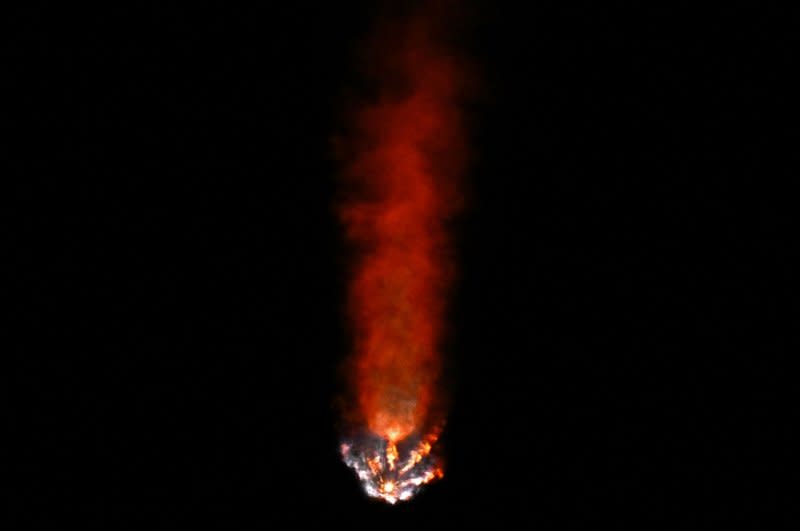 The exhaust plume of a SpaceX Falcon 9 rocket turns red at altitude as it launches NASA's Crew-7 astronauts to the International Space Station from Kennedy Space Center in Florida early Saturday morning. Photo by Joe Marino/UPI