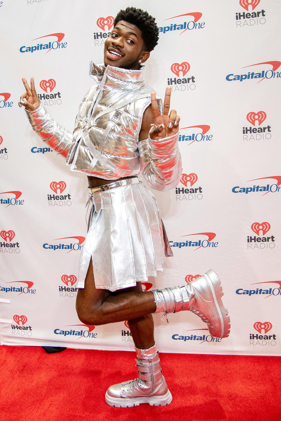 <p>Lil Nas X looks out of this world in head-to-toe silver as he poses on the red carpet for 106.1 KISS FM's iHeartRadio Jingle Ball on Nov. 30 in Fort Worth, Texas. </p>