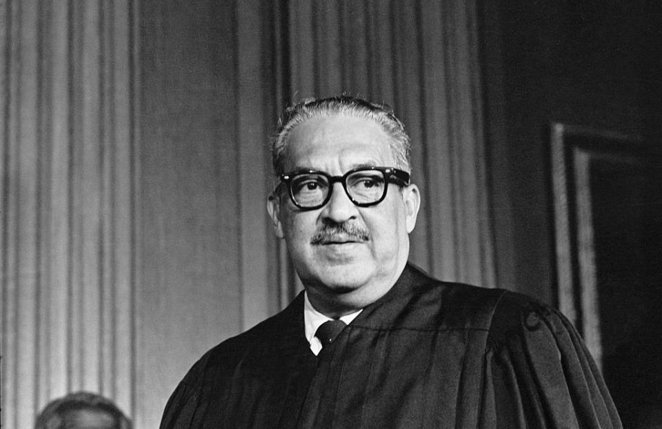 thurgood marshall, the great grandson of a slave, takes his seat as the first black member of the united states supreme court