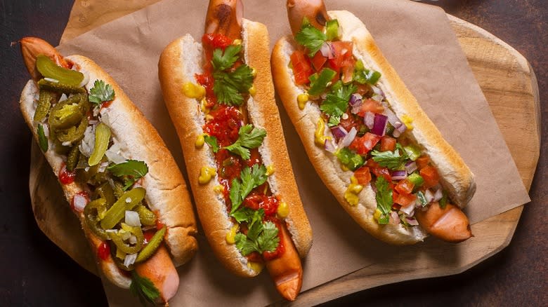 hot dogs with different spicy toppings