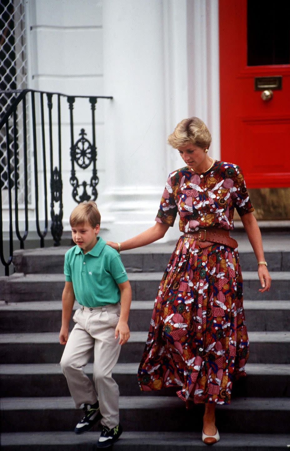 <p>Princess Di turned school drop-off into a fashion show once again in this printed maxi dress and belt.</p>