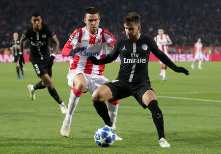 Soccer Football - Champions League - Group Stage - Group C - Crvena Zvezda v Paris St Germain - Rajko Mitic Stadium, Belgrade, Serbia - December 11, 2018 Paris St Germain's Juan Bernat in action with Crvena Zvezda's Marko Gobeljic REUTERS/Marko Djurica