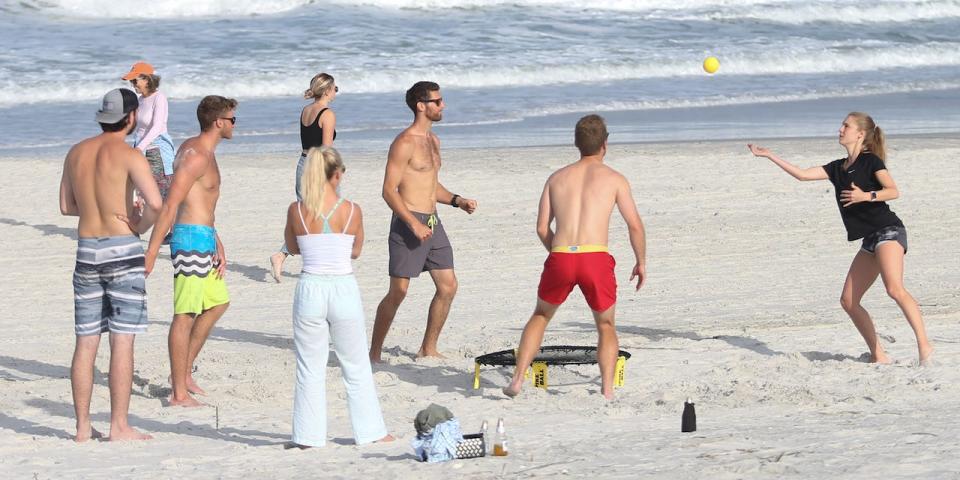 People play a game of Spike Ball on the beach in its first open hour on April 17, 2020 in Jacksonville Beach, Fl.