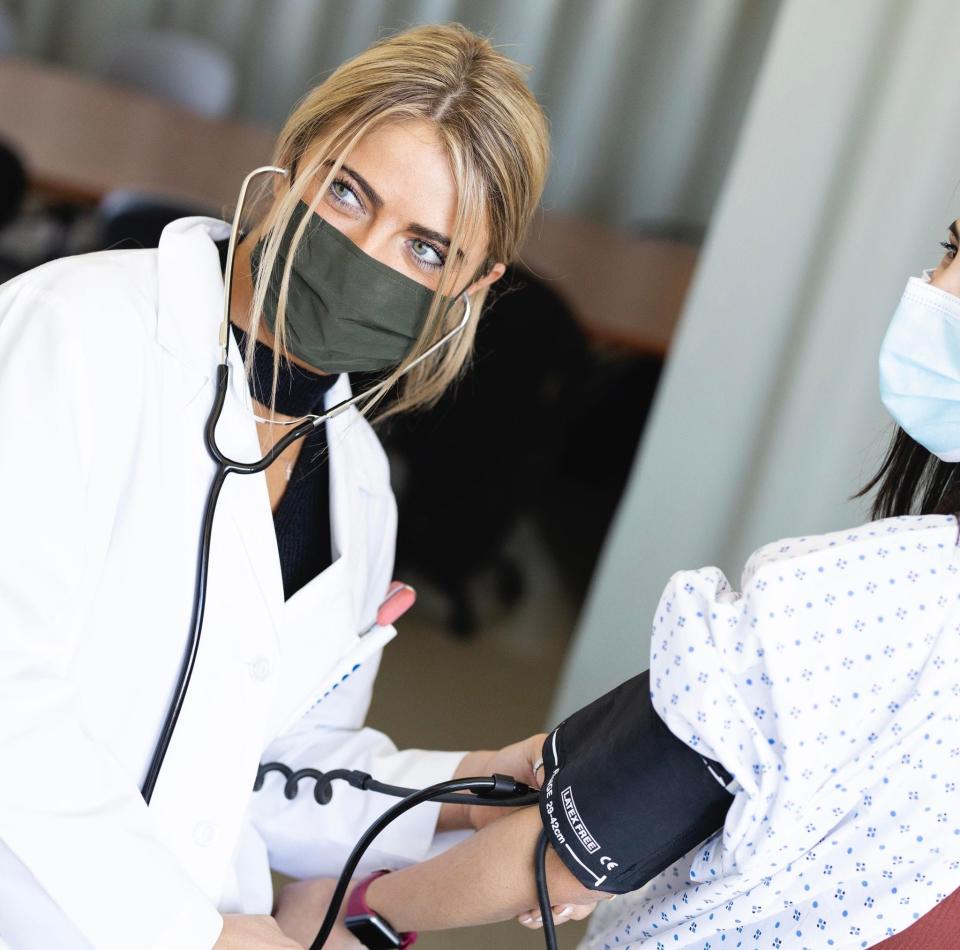 Alexandra Ford checks the blood pressure of a patient at Connecticut Children’s Hospital.