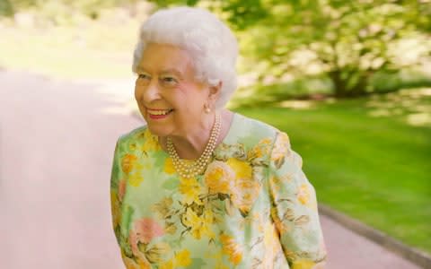 The Queen in the gardens of Buckingham Palace  - Credit: ITV