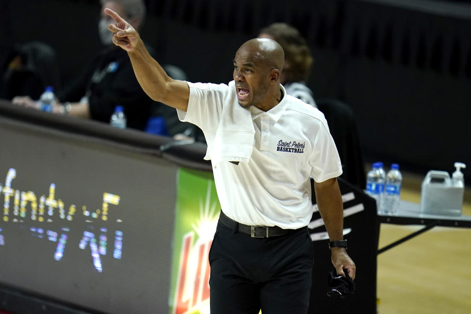 St. Peter's head coach Shaheen Holloway reacts during the first half of an NCAA college basketball game against Maryland, Friday, Dec. 4, 2020, in College Park, Md. (AP Photo/Julio Cortez)