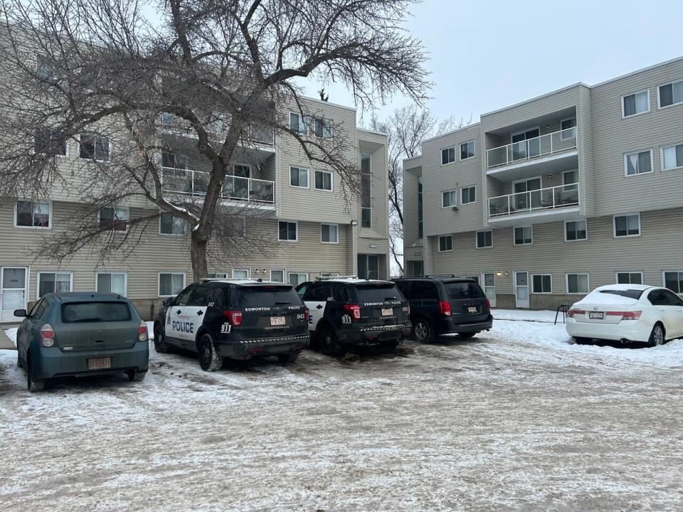 Edmonton police officers were seen entering the home of a man accused in a Tuesday shooting incident at city hall. 
