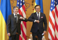 Ukrainian Foreign Minister Dmytro Kuleba, right, and U.S. Secretary of State Antony Blinken, greet each other by touching elbows to curb the spread of COVID-19 ahead of their meeting in Kyiv, Ukraine, Thursday, May 6, 2021. (AP Photo/Efrem Lukatsky, Pool)