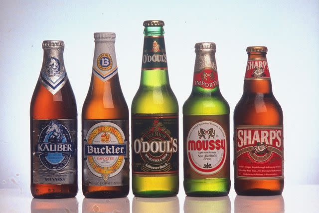 <p>James Keyser/Getty</p> Bottles of various brands of non-alcoholic beer