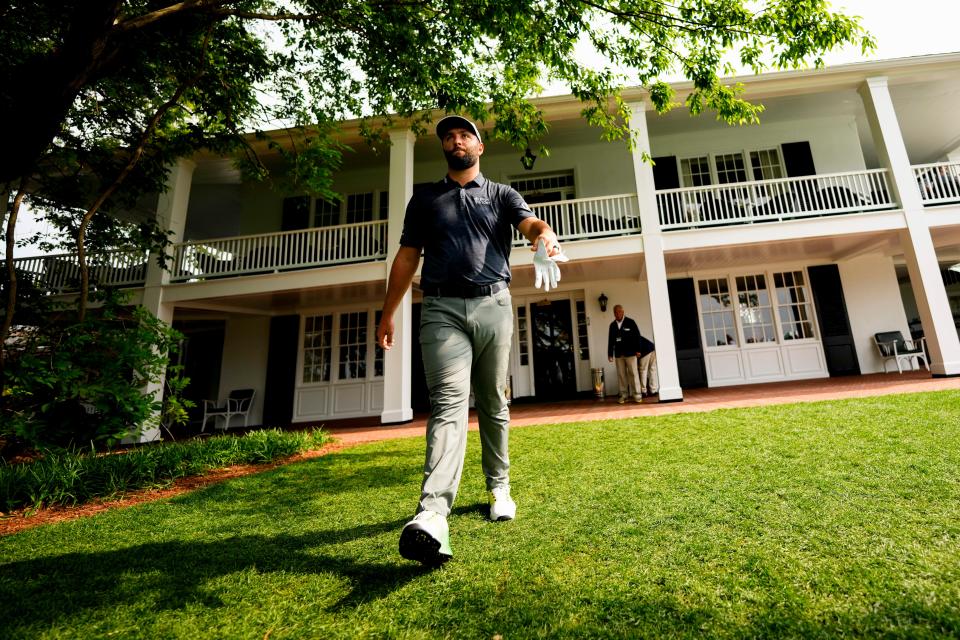 Jon Rahm leaves the clubhouse on his way to the first tee before Thursday's the first round of the Masters.