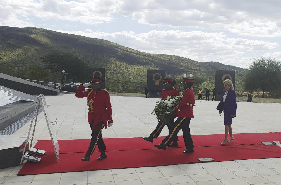 U.S. First Lady Jill Biden, right, at a wreath-laying ceremony at Windhoek's Heroes' Acre, Namibia Wednesday, Feb. 22, 2023. Biden is in the country as part of a commitment by President Joe Biden to deepen U.S. engagement with the region. (AP Photo/Dirk Heinrich)