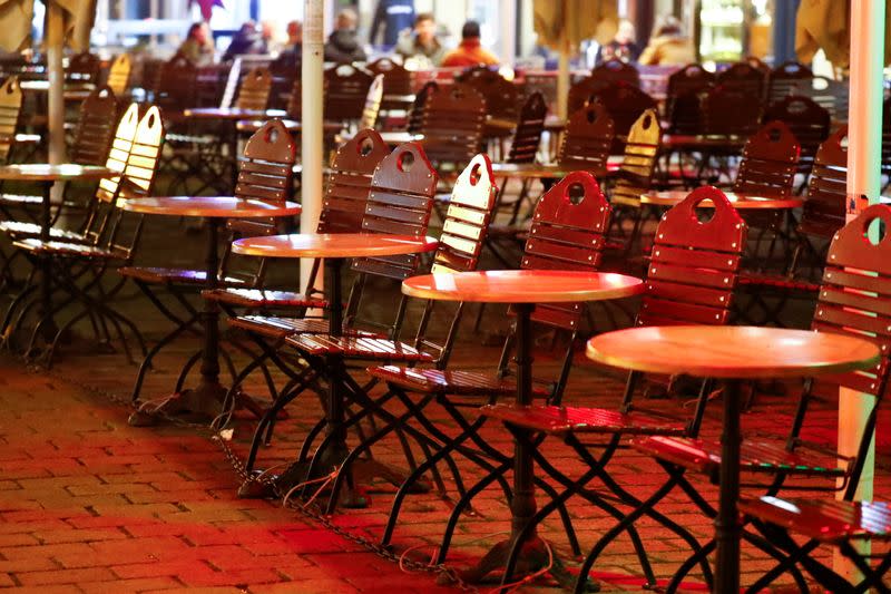 Empty tables of a restaurant are pictured, in Berlin's Mitte district