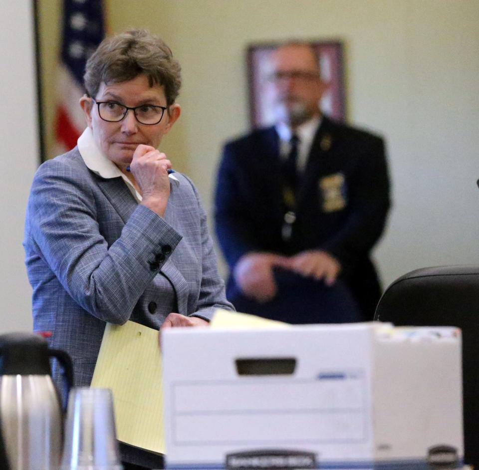 Defense attorney Julia Nye waits for jurors to leave the courtroom for lunch break during the double murder trial of her client Timothy Verrill at Strafford County Superior Court in Dover Friday, March 22, 2024.