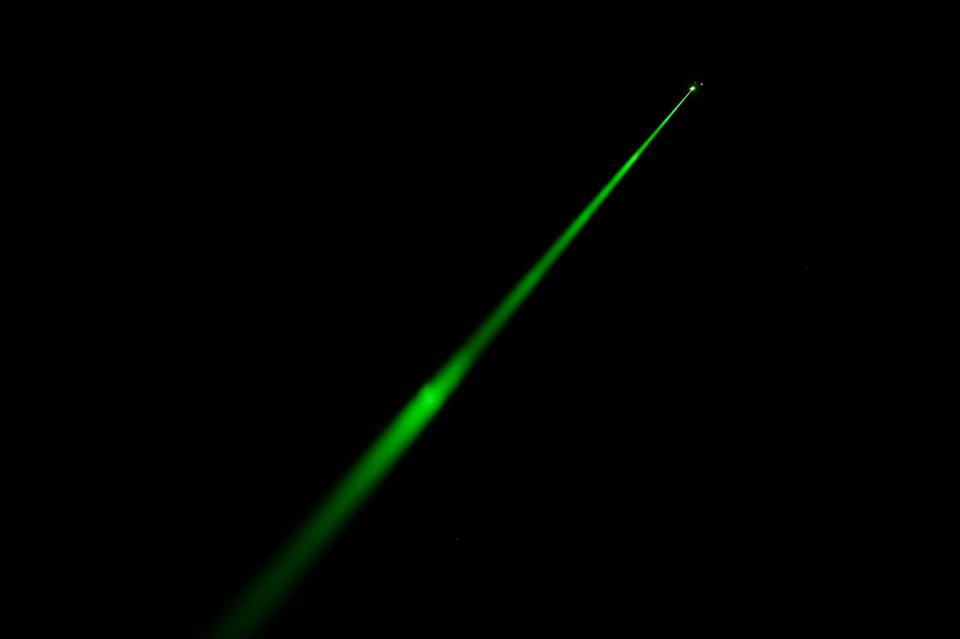 AC-130J Ghostrider gunship green laser beam light
