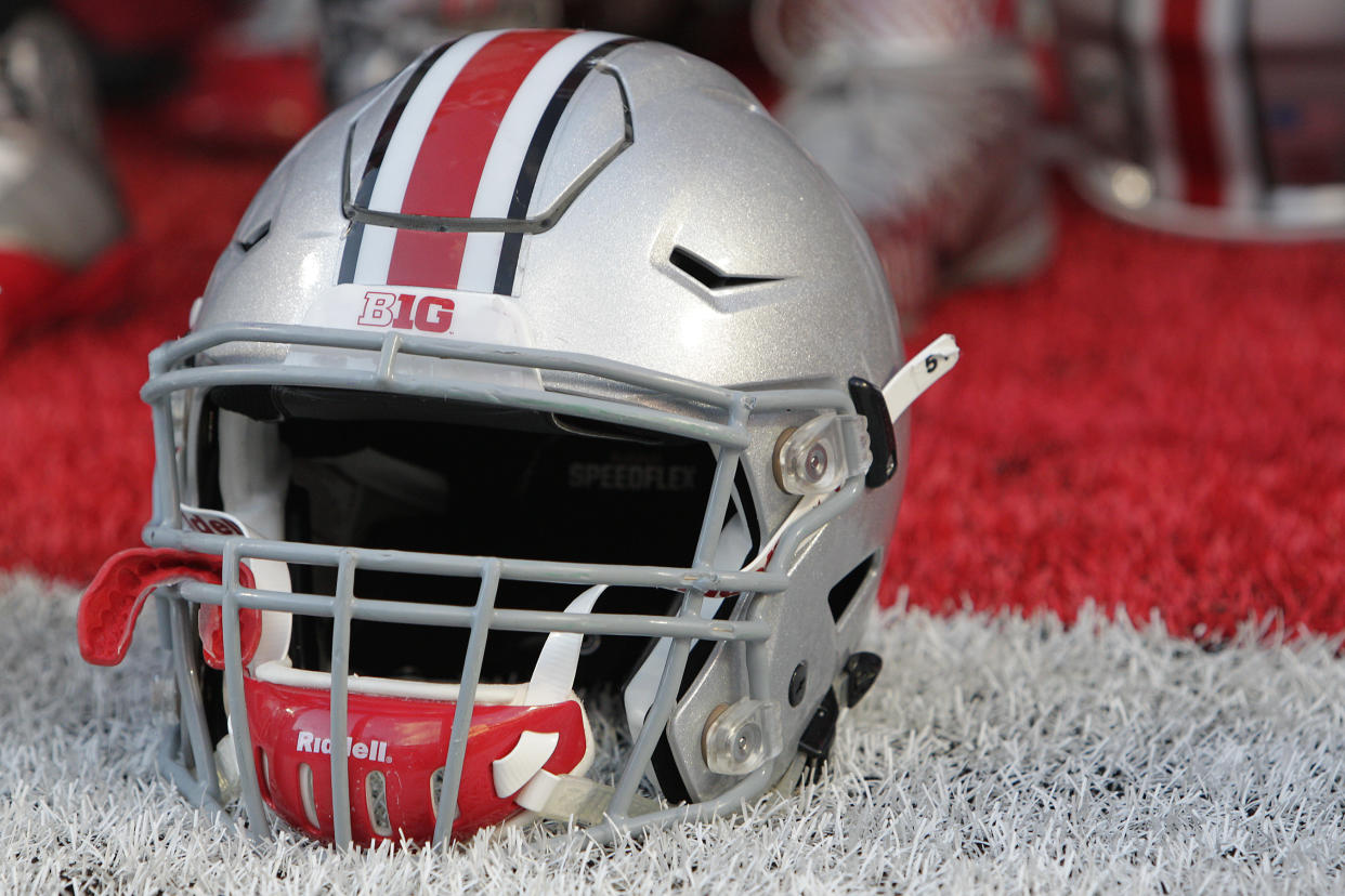 An Ohio State football helmet on the field after their NCAA college football game against Northern Illinois during an NCAA college football game Saturday, Sept. 19, 2015, in Columbus, Ohio. (AP Photo/Jay LaPrete)