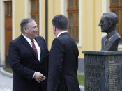 Slovakia Foreign Affairs Minister Miroslav Lajcak, right, welcomes US Secretary of State Mike Pompeo during his visit to Bratislava, Slovakia, Tuesday, Feb. 12, 2019. Pompeo is in Slovakia on the second leg of a five-nation European tour that began in Hungary and will take him to Poland, Belgium and Iceland. (AP Photo/Petr David Josek)