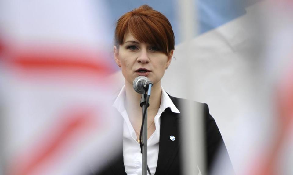 An FBI agent said Maria Butina, pictured above at a gun rights rally in Russia in 2013, tried to develop secret back channels with American politicians.