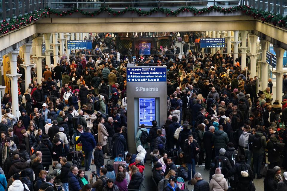 Passengers wait on the concourse at the entrance to Eurostar in St Pancras International station (PA Wire)
