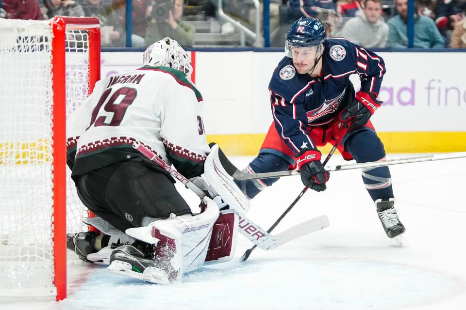 Nov 16, 2023; Columbus, Ohio, USA; Columbus Blue Jackets right wing Justin Danforth (17) shoots at Arizona Coyotes goaltender Connor Ingram (39) during the first period of the NHL hockey game at Nationwide Arena.